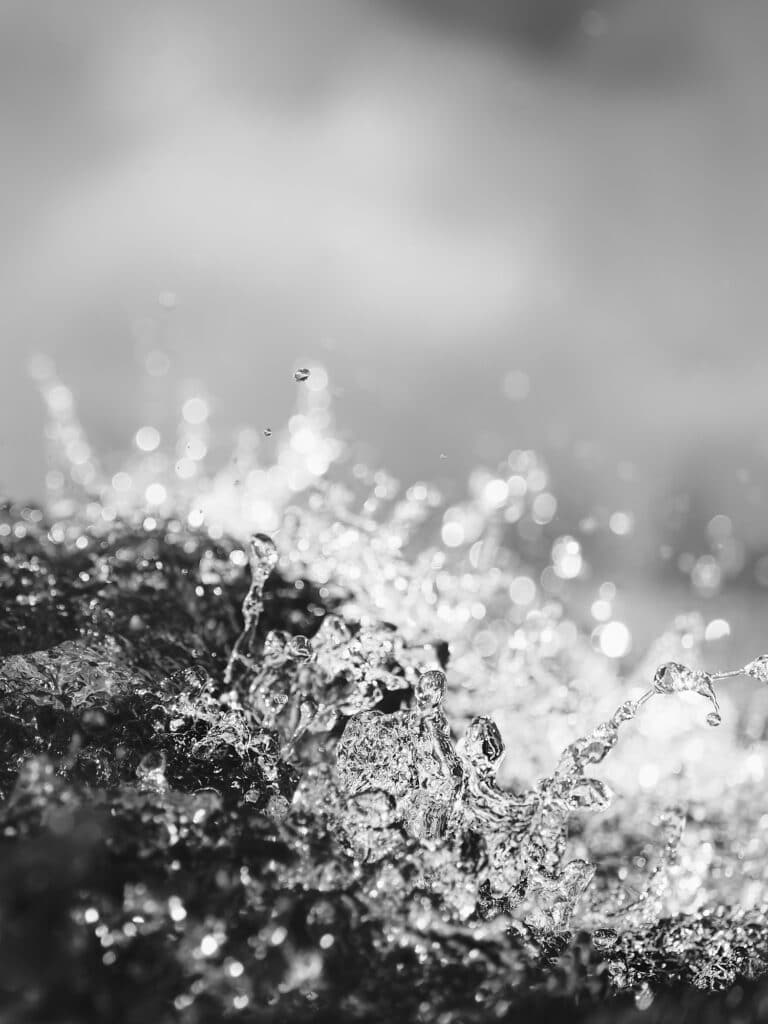 fine art photography of splashing water drops looking like the Mare Imbrium on the moon