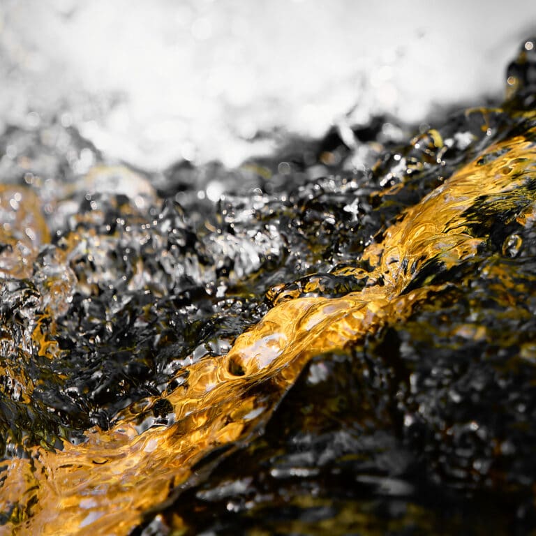 fine art photography of splashing water drops looking like the Milky Way