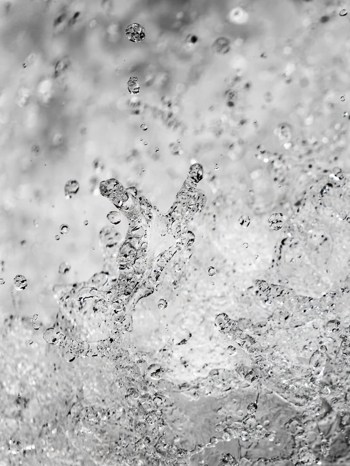 fine art photography of splashing water drops looking like a nebula