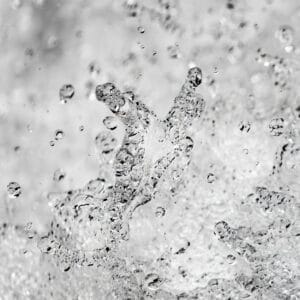 fine art photography of splashing water drops looking like a nebula