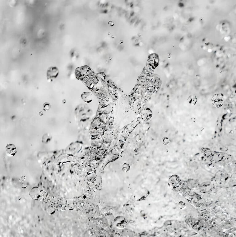 fine art photography of splashing water drops looking like a nebula
