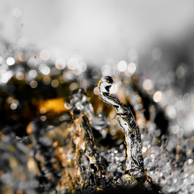 fine art photography of splashing water drops looking like the Pillars of Creation Nebula