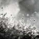fine art photography of splashing water drops looking like a stellar flare