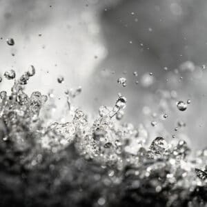 fine art photography of splashing water drops looking like a stellar flare