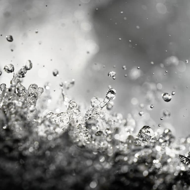 fine art photography of splashing water drops looking like a stellar flare