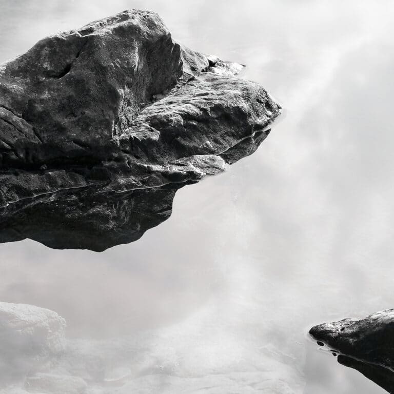 stones in water, looking like floating through space and time